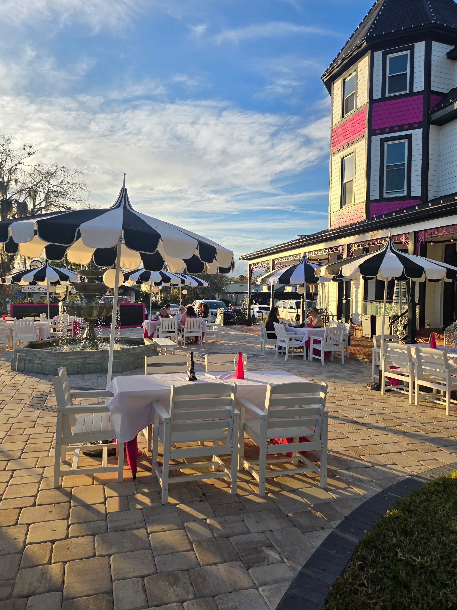 The black, white, and pink 1890 Tea House outdoor patio